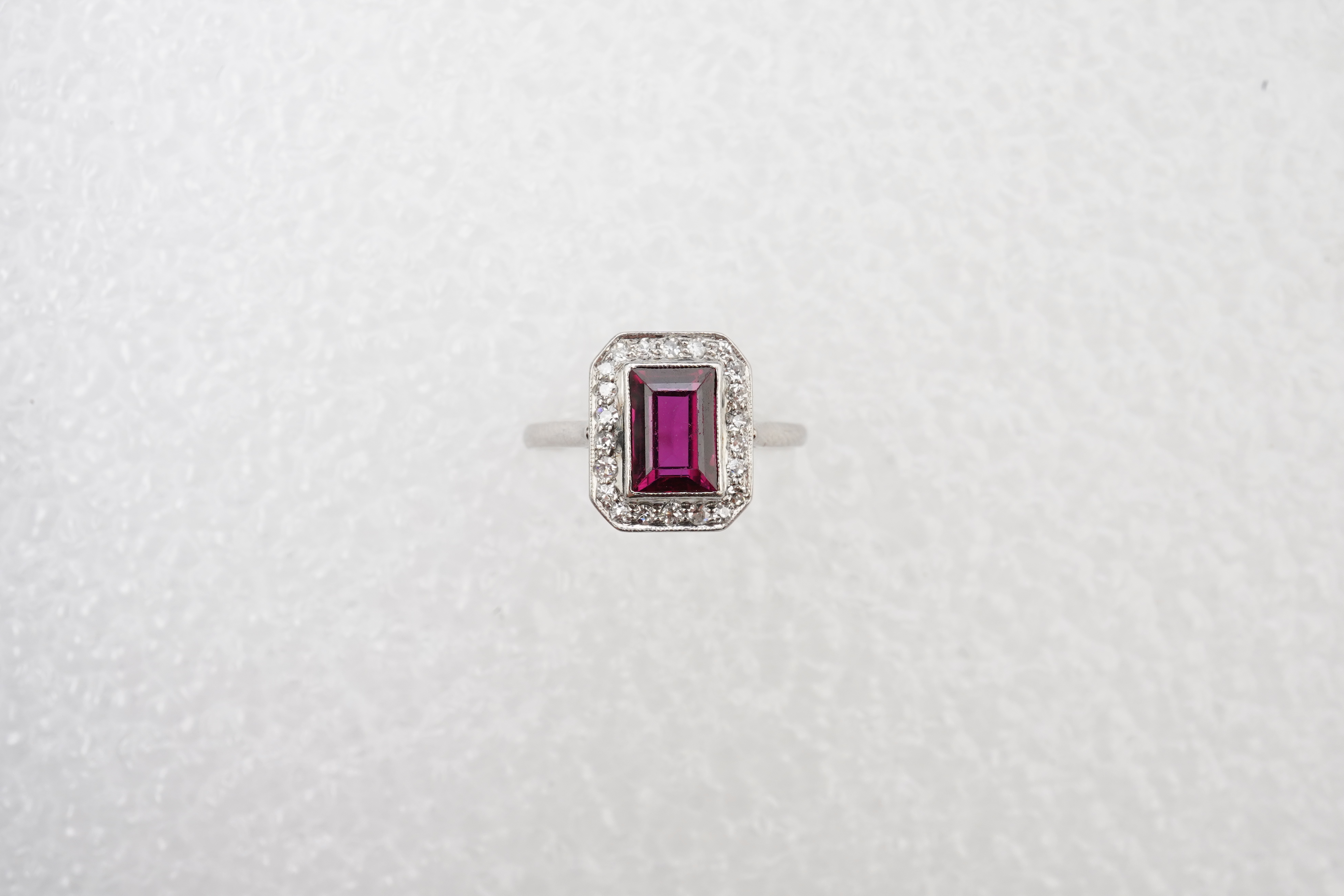 A synthetic ruby and diamond cluster ring, early 20th century